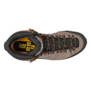 Top view of the Salewa Men’s Alp Trainer 2 Mid GORE-TEX Hiking Boot, a waterproof hiking boot built for mountain terrain, featuring brown and black uppers with orange and black laces, a black mesh tongue, and yellow Salewa branding on the insole.