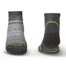Pair of gray socks with a patterned design on a white background, featuring the Bridgedale brand.