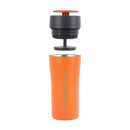 A Lifeventure One-Touch Thermal Mug in orange, with its black one-touch lid and inner seal separated and floating above the stainless steel cup to display each part individually.
