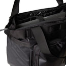 Discover The North Face Base Camp Voyager Tote Bag, expertly crafted from recycled durable fabric. This black tote features a spacious 25-litre capacity, a padded interior sleeve to securely hold your silver laptop, sturdy handles, and a convenient zippered pocket—making it perfect for carrying all your daily essentials.