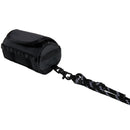 The North Face Base Camp Mini Duffel, a small black pouch with a Velcro flap resembling a keychain bag, is attached to a black and white rope leash with a metal clasp, displayed on a plain white background.