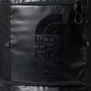 Close-up of a black backpack featuring a glossy Great Outdoors logo and zipper detail, with a smooth texture and minimalistic design, reminiscent of the versatile Base Camp Boot Bag often used as a ski boot bag.