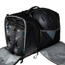 A black Great Outdoors Base Camp Boot Bag with two compartments—one containing a pair of ski boots and the other holding a helmet. Both sections are unzipped to display the neatly packed gear inside, set against a plain white background.
