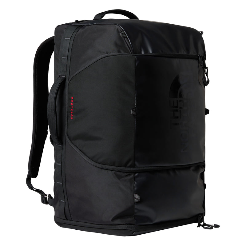 A black Great Outdoors Base Camp Boot Bag with padded straps, multiple compartments, and a sleek, durable design—perfect for carrying your snowboarding boots. The logo appears subtly on the front, and the bag stands upright against a white background.