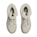 A top view of a pair of The North Face Womens ThermoBall Leather Waterproof Boots in light beige, featuring white fleece lining, laces, and The North Face logo on the insoles.