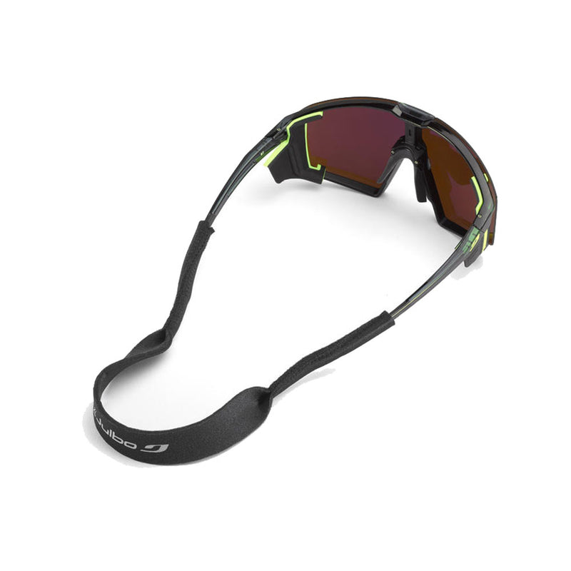 Julbo Neoprene Headband (XL) in black, attached to sport sunglasses with dark red lenses, black frames, and neon yellow accents—ideal for outdoor sports—displayed on a white background.