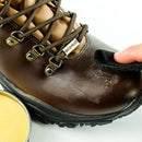 Leather boot having grangers G-WAX applied to it with a microfibre cloth.