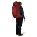 Osprey Aura AG 65 Backpack worn, full length side profile, Berry Sorbet