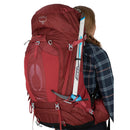 Osprey Aura AG 65 Backpack worn, three-quarter view, Berry Sorbet
