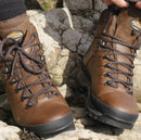 Meindl bhutan pair worn on a rocky surface with hiking socks