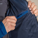 A person unzips the blue mesh inner pocket of the Craghoppers Mens Ponsa Waterproof Jacket, focusing on its detailed texture. Only their hands and a section of the jacket are visible.