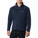 A man wearing a full zip fleece jacket in collegiate navy color by Columbia.