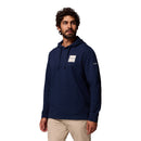 Man wearing a navy blue hoodie with a brand logo on a white background