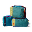 Set of three colorful packing cubes with Cotopaxi branding on a white background