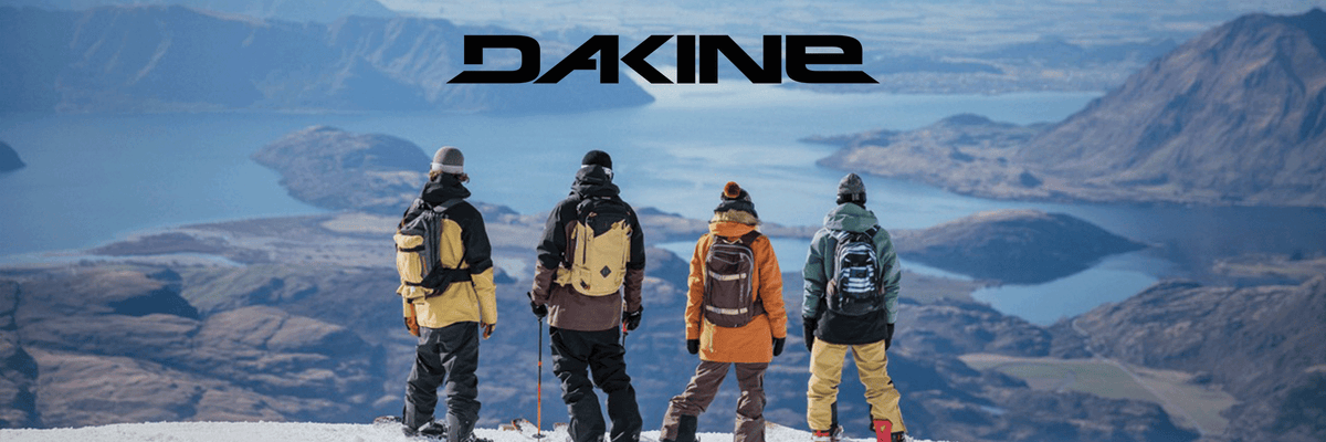 Dakine ski gear four skiiers on a mountain