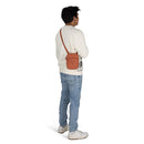 Osprey Daylite Small Crossbody Bag worn, side profile, Porcelain Orange