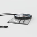 Compass with a clear ruler on a white background
