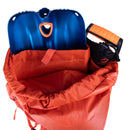top-loading opening from a blue ice firecrest 38l backpack on a white background