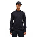 A man wearing a black cap and the Peak Performance Mens Trail Polartec Power Grid Half Zip Fleece stands facing the camera with a neutral expression against a plain white background.