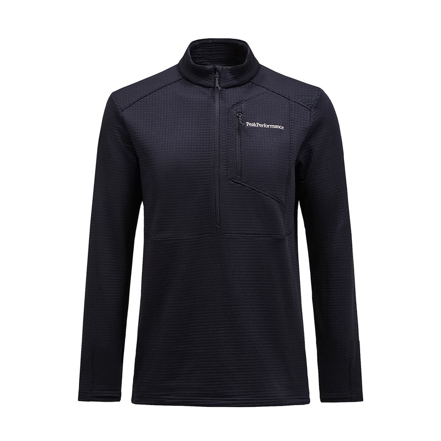 The Mens Trail Polartec Power Grid Half Zip Fleece by Peak Performance is a black long-sleeve technical midlayer featuring a high collar, zippered chest pocket, and the Peak Performance logo in white on the left chest. Crafted from Polartec Power Grid fabric, this mens trail fleece offers comfort and performance on the move.