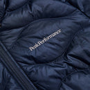 Close-up of the Womens Helium Down Hood Jacket by Peak Performance in navy blue, featuring quilted lightweight, packable down and white Peak Performance embroidery next to a visible zipper.