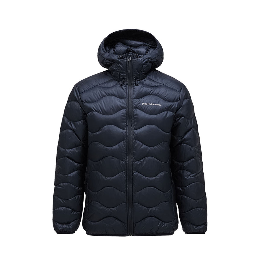 The Mens Helium Down Hooded Jacket by Peak Performance features a black, ultralight, and packable design with a front zipper and subtle wave-like stitching. A small logo on the left chest adds a stylish touch, making this jacket an ideal choice for those seeking comfort and contemporary flair.