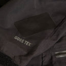 Gore-Tex logo on a black jacket with a gore tex patch covering a tear