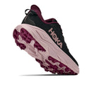 The Hoka Womens Challenger 8 Trail Running Shoe is displayed from the back and bottom, emphasizing its thick, textured sole, cushioned midsole, and featuring the Hoka logo on the side.
