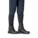 Rab Latok GORE-TEX Gaiter worn over boot, three-quarter view, Black
