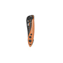 A compact, folded Leatherman Skeletool® KB Knife with an orange and black handle, circular cutouts, and branded side—ideal for everyday carry with a durable 420HC stainless steel blade.