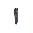 The Leatherman Skeletool® KB Knife, shown folded with a blue and black handle featuring circular cutouts and the Leatherman logo, is an ideal everyday carry knife with a 420HC stainless steel blade against a white background.