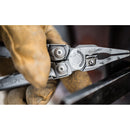 A gloved hand uses the Leatherman Surge Multitool, showcasing its sturdy pliers and innovative blade exchanger, with a softly blurred background.