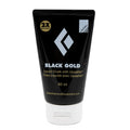 A 60ml tube of Black Gold liquid chalk with the Black Diamond logo and text indicating its grip-enhancing properties.