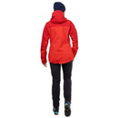 A person shown from the back wearing a bright red hooded jacket, black pants, and a dark navy beanie against a plain white background.