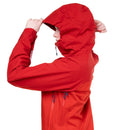 A person wearing a bright red hooded jacket, shown from the side and back, adjusting the hood against a plain white background.
