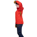 A woman modeling a bright red outdoor jacket with a high hood, paired with dark navy pants and tan gloves, shown against a plain white background.