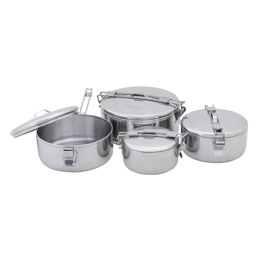 Four MSR Alpine StowAway Pots with clamp locks and lids are arranged together; they come in different sizes and shapes, all featuring a polished stainless steel finish. Ideal for camping cookware, these durable MSR pots serve as both secure food storage containers and reliable vessels for heating meals outdoors or at home.