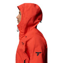 A person in profile faces left wearing Columbia’s Mens Saudan Pro™ 3L Shell Jacket in bright red, featuring a logo on the upper arm and an adjustable drawstring hood, set against a white background.