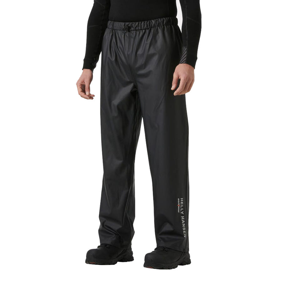 Person wearing black rain pants with a visible brand logo on a white background