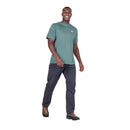 Model wearing Men’s Podus Tee green side walking