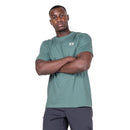 Model wearing Men’s Podus Tee green standing with arms crossed