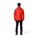 A person stands facing away, wearing a bright red Rab Mens Microlight Alpine Hoody with a hood and dark pants, set against a white background. The jacket features recycled down, offering both warmth and sustainability.