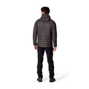 A person wearing the Rab Mens Microlight Alpine Hoody in black, along with black pants and black shoes, stands with their back to the camera against a white background.