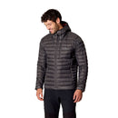 A man wearing the Rab Mens Microlight Alpine Hoody in black—crafted with recycled down—and matching black pants stands against a plain white background, looking down and smiling.