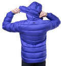 Model wearing blue down jacket, adjusting hood