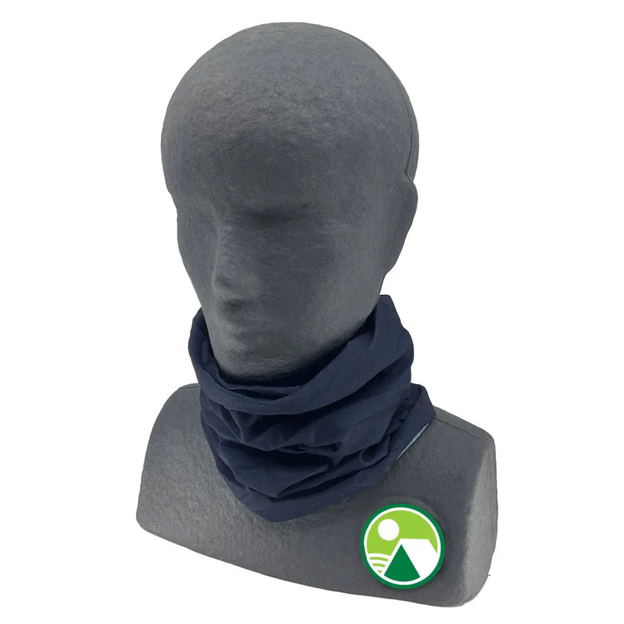 A gray, featureless mannequin bust displays the Great Outdoors Ireland Multifunctional Bandana - Navy Solid. A round green and white logo appears on the right shoulder of the mannequin.
