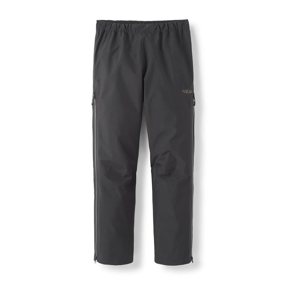 The Rab Mens Namche Hike GORE-TEX Pants are black waterproof overtrousers featuring an elastic waistband, zippered side pockets, and lower leg zippers. Designed for durability and comfort on the trails, these hiking pants provide excellent protection in wet conditions. The pants are shown against a white background.