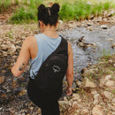 Osprey Daylite Sling Bag worn outdoors, lifestyle shot