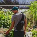 Osprey Daylite Sling Bag worn outdoors, lifestyle shot