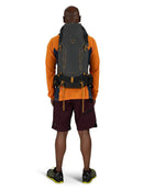 Osprey Talon Velocity 30 Backpack worn, full length back, Dark Charcoal/Tumbleweed